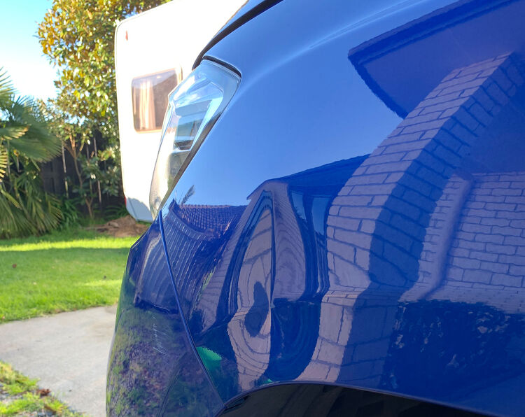 Blue car with dent