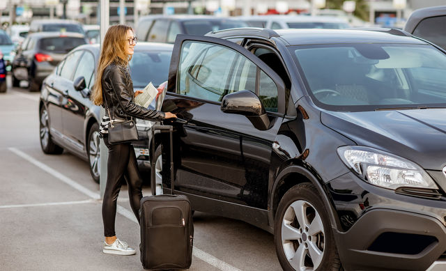 Car Rental Woman getting into car