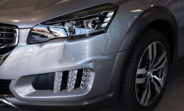 Panel Shops Silver car with dent at the front